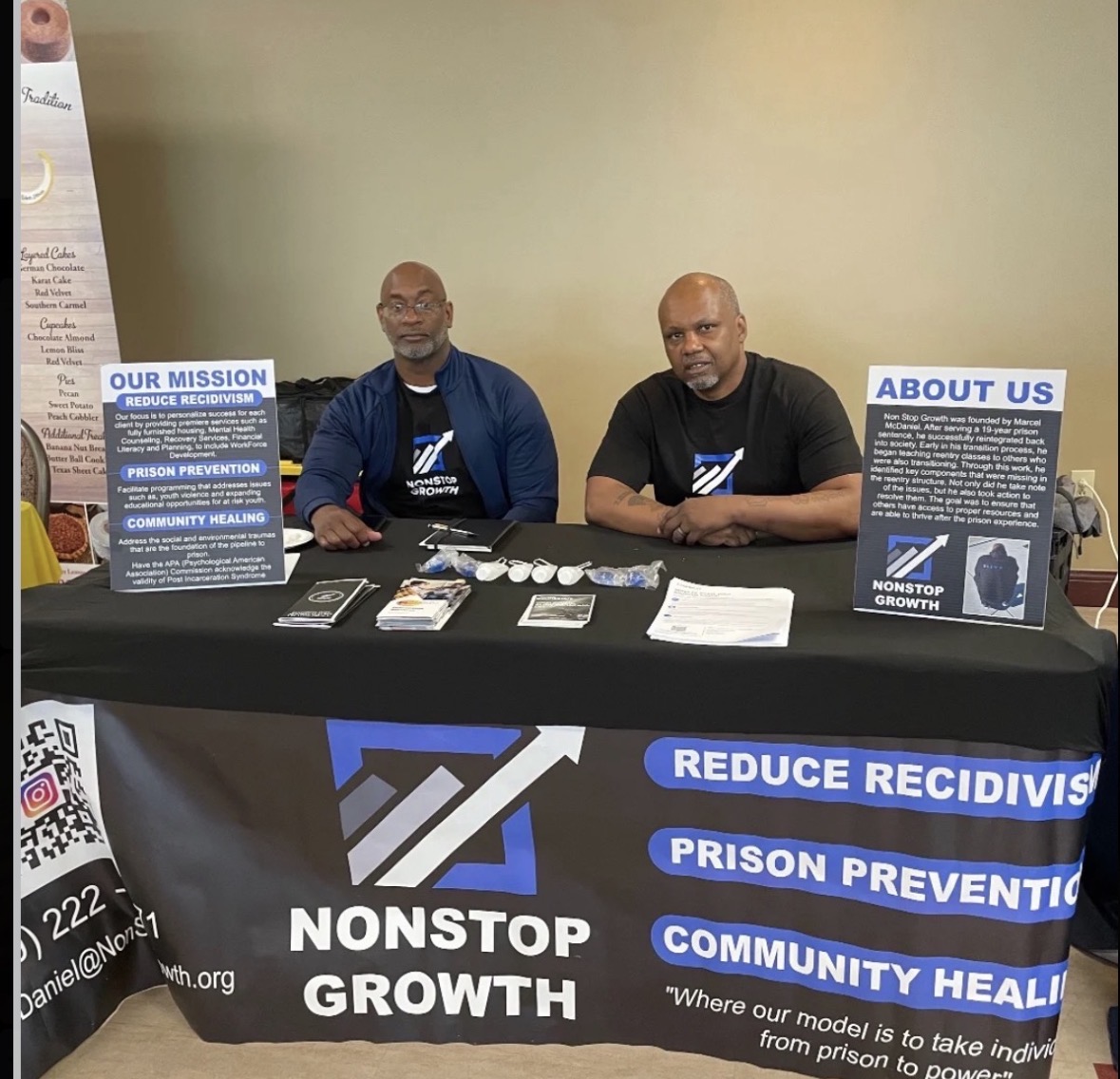 Marcel McDaniel and Larry Dawson Sr. representing Non Stop Growth at a community event.